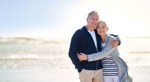 Elderly Couple Hugging on a Beach